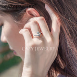 Curved Band Pear-Cut Moissanite Engagement Ring